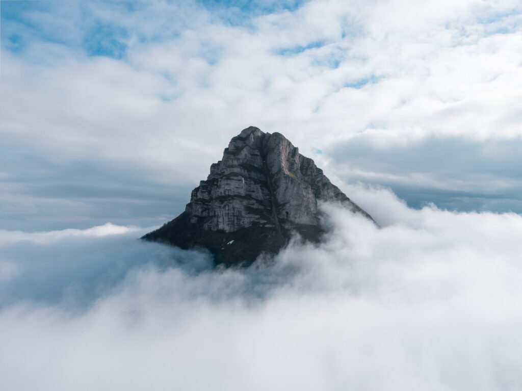 Mountain peak showing through clouds