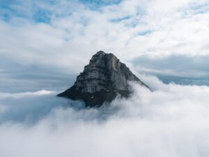 Mountain peak showing through clouds