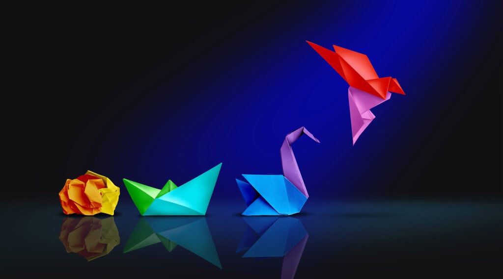 Colorful origami animals on a dark background for team building activities.